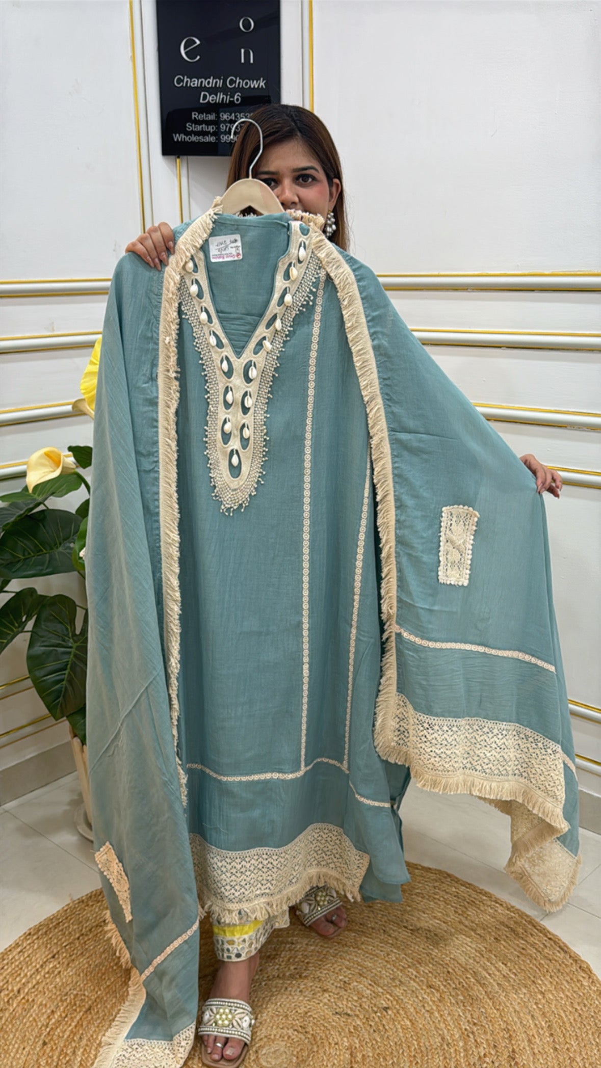 Elegant teal kaftan by The Grace Fashion with intricate embroidery and stylish detailing